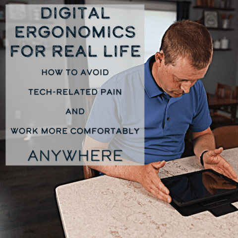 Man using a tablet at a kitchen counter with their neck bent.